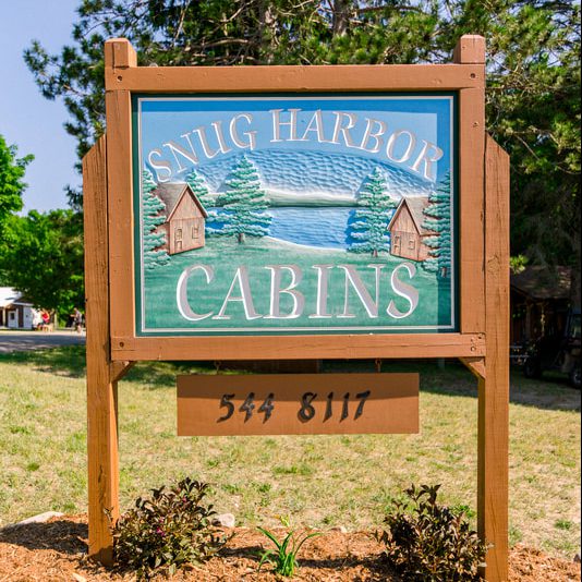 Snug Harbor Cabins Sign